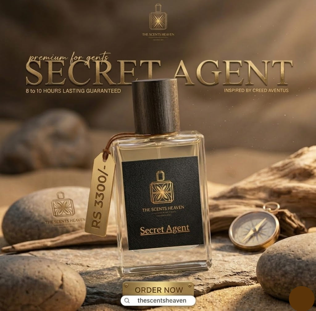 Perfume bottle labeled 'Secret Agent' on a rocky surface with desert-themed elements.